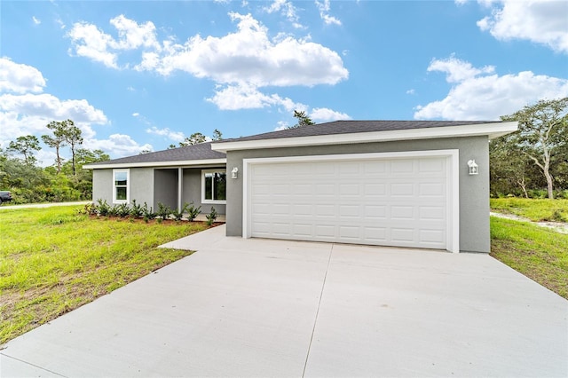 ranch-style house featuring a garage, stucco siding, concrete driveway, and a front yard