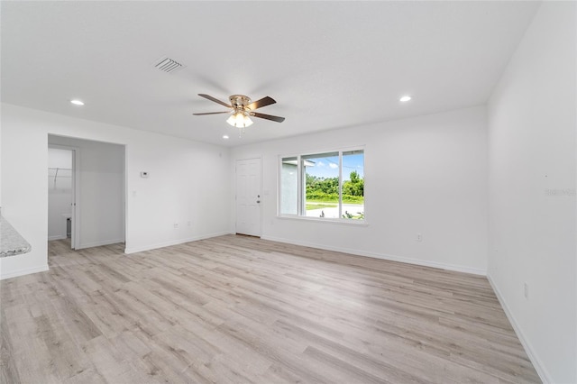 empty room with recessed lighting, visible vents, light wood-style floors, and a ceiling fan