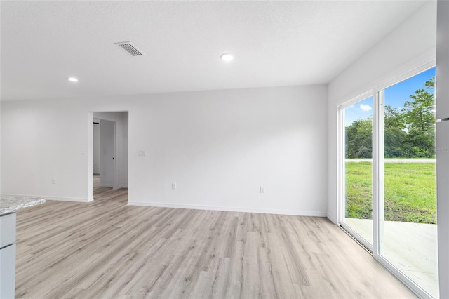 spare room featuring recessed lighting, visible vents, baseboards, and light wood finished floors