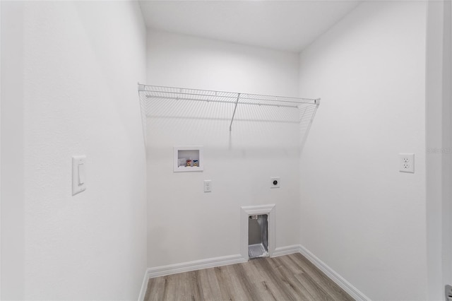 laundry room with electric dryer hookup, washer hookup, light wood finished floors, baseboards, and laundry area