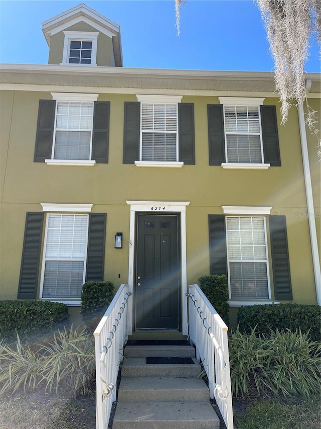 6274 Bristol Channel Way, Orlando, FL 32829 - view of front of property with stucco siding