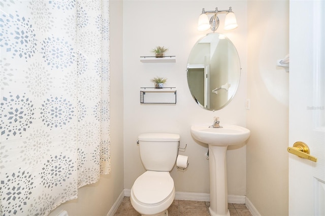 6274 Bristol Channel Way, Orlando, FL 32829 - bathroom with a sink, baseboards, toilet, and tile patterned flooring