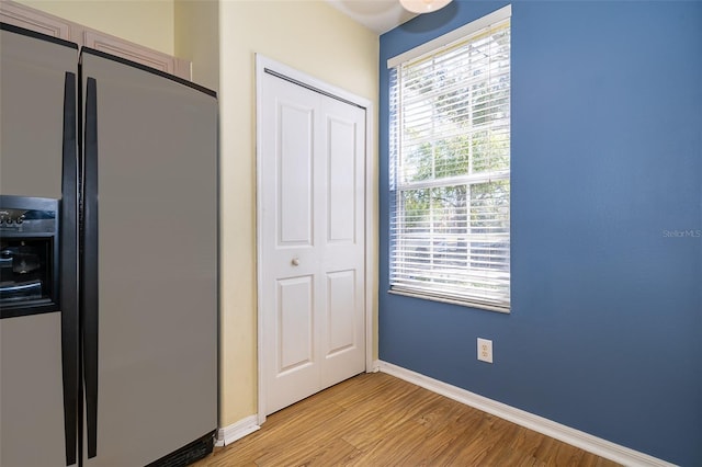 6274 Bristol Channel Way, Orlando, FL 32829 - interior space with refrigerator with ice dispenser, light wood-type flooring, and baseboards