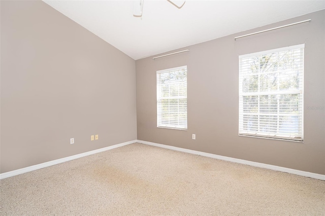 6274 Bristol Channel Way, Orlando, FL 32829 - unfurnished room with vaulted ceiling, carpet flooring, and baseboards