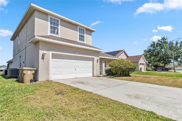 traditional home with a front yard, concrete driveway, stucco siding, an attached garage, and central AC unit