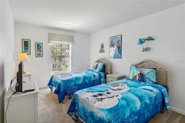 bedroom featuring baseboards and carpet floors