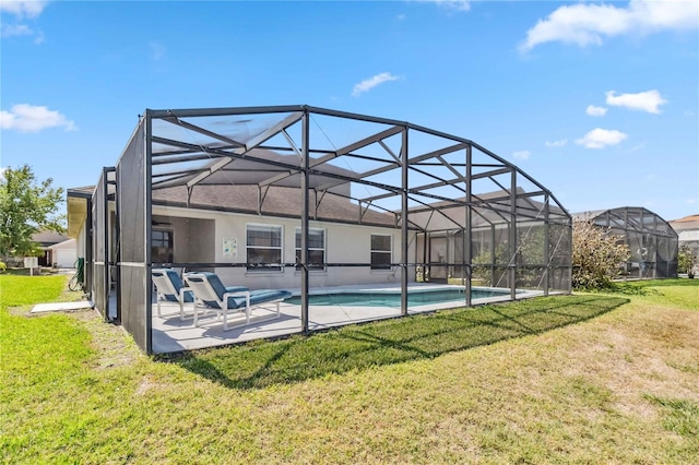 pool featuring a lanai, a yard, and a patio area