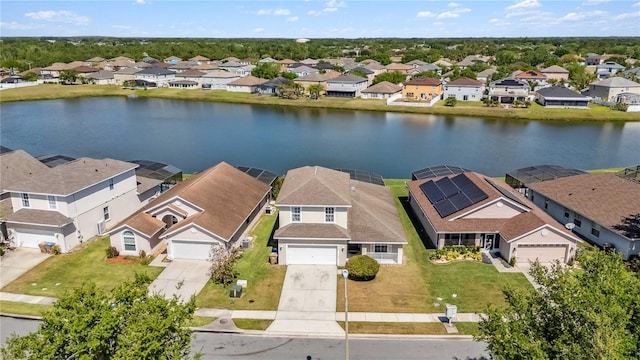 birds eye view of property featuring a residential view and a water view