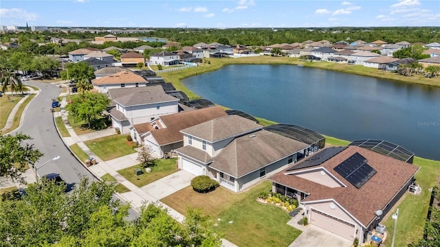birds eye view of property with a residential view and a water view