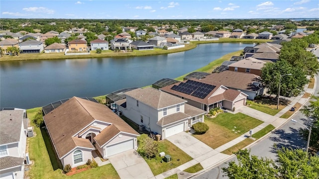 bird's eye view with a residential view and a water view