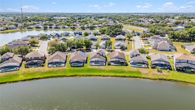 drone / aerial view featuring a water view and a residential view