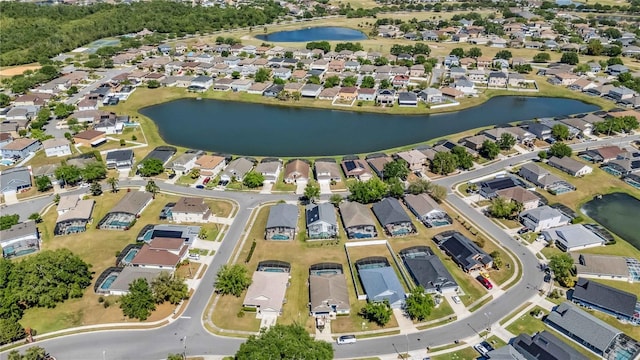 birds eye view of property with a residential view and a water view