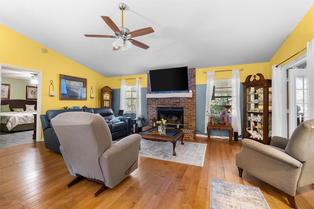 living area with a ceiling fan, a healthy amount of sunlight, and light wood-style flooring