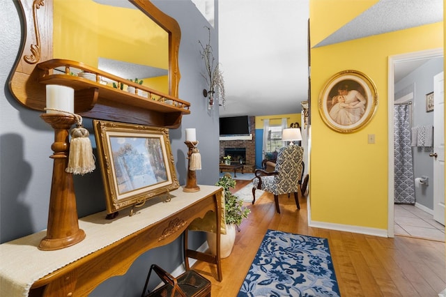 interior space featuring baseboards and wood finished floors