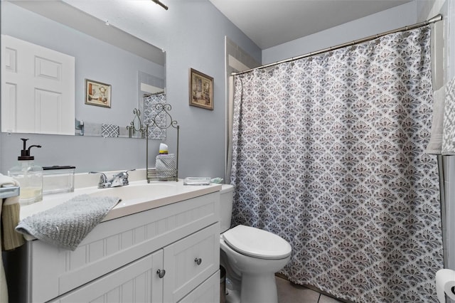 full bathroom with curtained shower, toilet, tile patterned flooring, and vanity