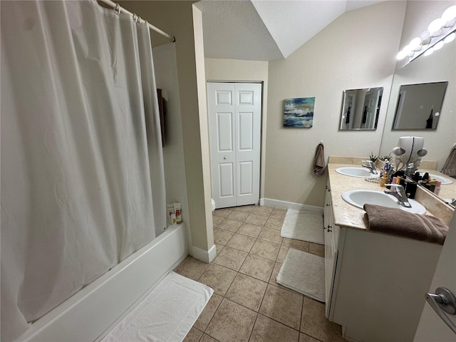 2964 Lucayan Harbour Cir Unit 106, Kissimmee, FL 34746 - bathroom featuring vaulted ceiling, a sink, tile patterned flooring, and shower / tub combo