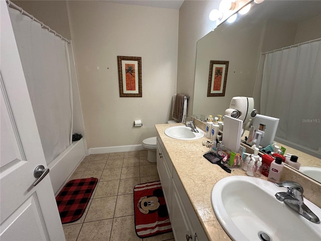 2964 Lucayan Harbour Cir Unit 106, Kissimmee, FL 34746 - full bathroom featuring tile patterned flooring, a sink, baseboards, and toilet