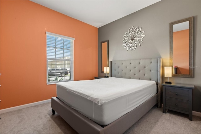bedroom featuring baseboards and carpet flooring