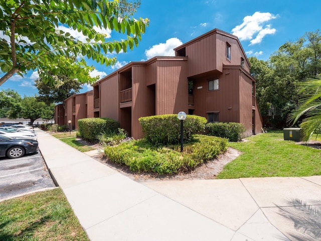 1092 E Michigan St Unit 1, Orlando, FL 32806 - view of building exterior featuring uncovered parking