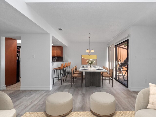 1092 E Michigan St Unit 1, Orlando, FL 32806 - living area with light wood finished floors and baseboards