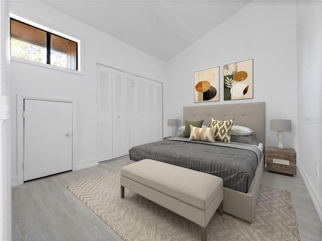 1092 E Michigan St Unit 1, Orlando, FL 32806 - bedroom with light wood-style floors, vaulted ceiling, a closet, and baseboards