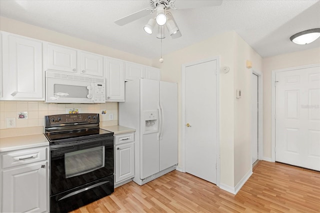 kitchen featuring a ceiling fan, light countertops, white appliances, backsplash, and white cabinets