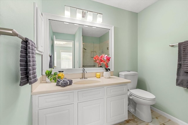 full bathroom featuring baseboards, toilet, a stall shower, and vanity