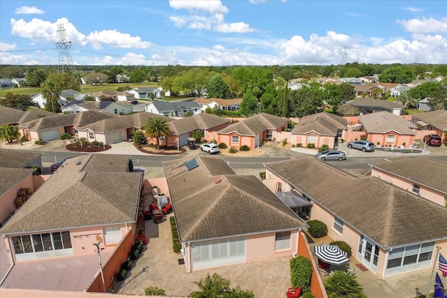 birds eye view of property with a residential view