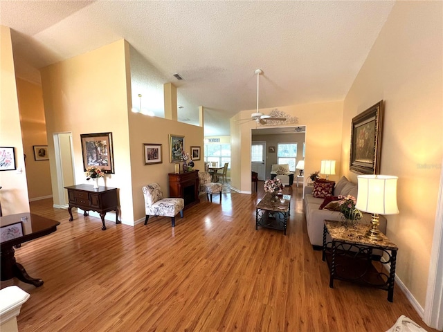 4638 River Ridge Drive, Leesburg, FL 34748 - living area featuring light wood finished floors, visible vents, baseboards, and ceiling fan