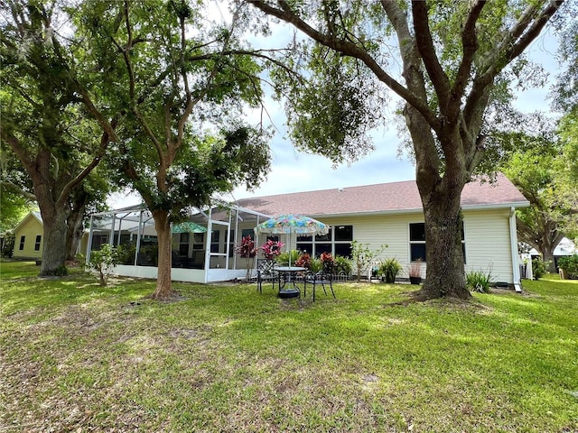 4638 River Ridge Drive, Leesburg, FL 34748 - back of property featuring glass enclosure and a yard