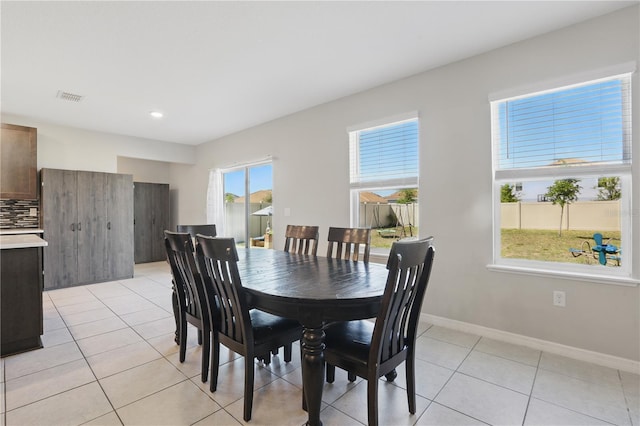 1158 Oak Bluff Dr, Davenport, FL 33837 - dining space featuring light tile patterned flooring and recessed lighting