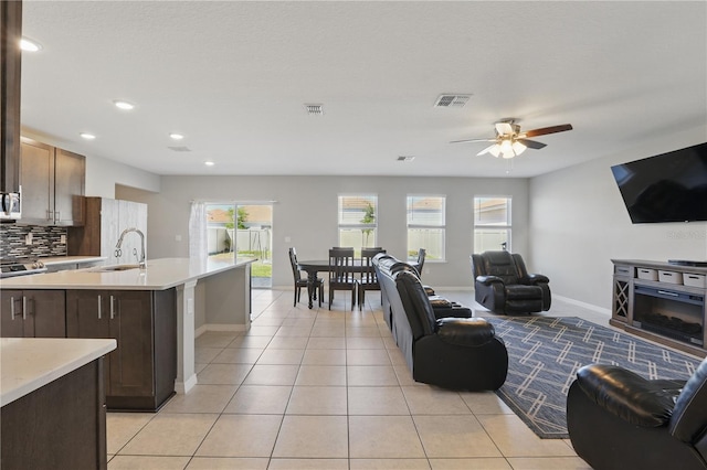 1158 Oak Bluff Dr, Davenport, FL 33837 - living area featuring a ceiling fan, recessed lighting, and light tile patterned flooring