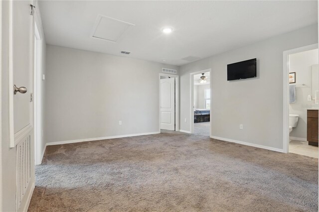 1158 Oak Bluff Dr, Davenport, FL 33837 - unfurnished bedroom with carpet floors, connected bathroom, attic access, and recessed lighting