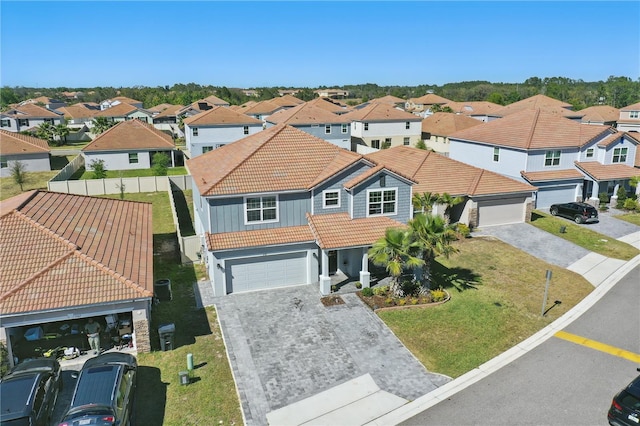 1158 Oak Bluff Dr, Davenport, FL 33837 - view of front of property featuring a tiled roof, a residential view, and driveway