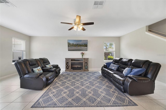 1158 Oak Bluff Dr, Davenport, FL 33837 - living room featuring a ceiling fan, light tile patterned flooring, and plenty of natural light
