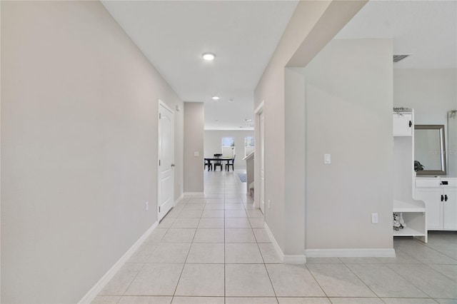 1158 Oak Bluff Dr, Davenport, FL 33837 - hallway featuring light tile patterned floors and recessed lighting