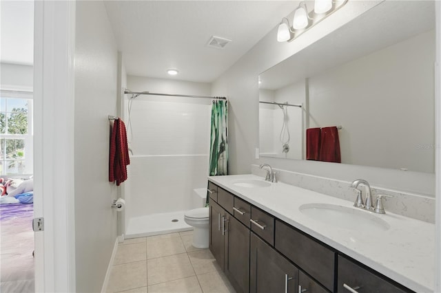 1158 Oak Bluff Dr, Davenport, FL 33837 - full bathroom featuring a tile shower, double vanity, and tile patterned floors