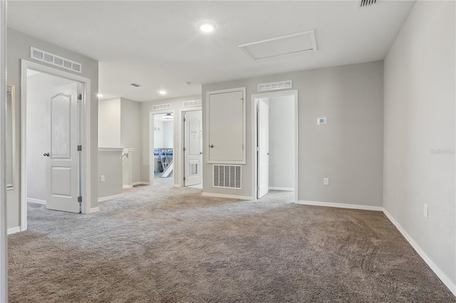 1158 Oak Bluff Dr, Davenport, FL 33837 - spare room featuring light colored carpet, recessed lighting, and attic access