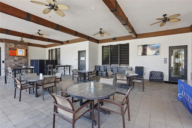 1158 Oak Bluff Dr, Davenport, FL 33837 - dining area featuring beam ceiling and ceiling fan