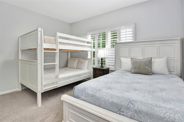 carpeted bedroom with baseboards