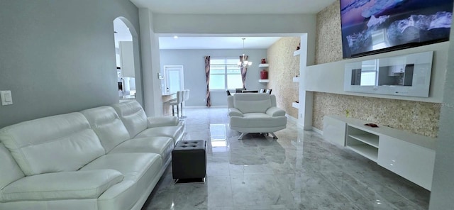 4730 Capital Blvd, Saint Cloud, FL 34769 - living area with marble finish floor, a notable chandelier, baseboards, and arched walkways