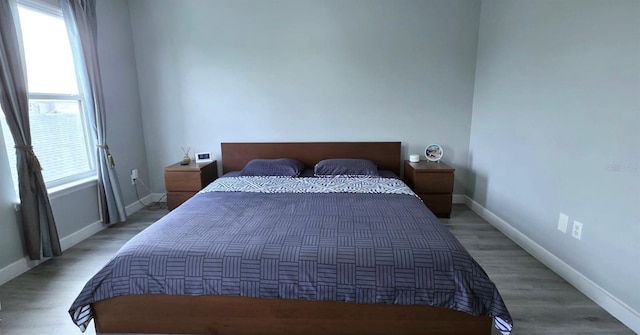 4730 Capital Blvd, Saint Cloud, FL 34769 - bedroom with baseboards and light wood-style floors