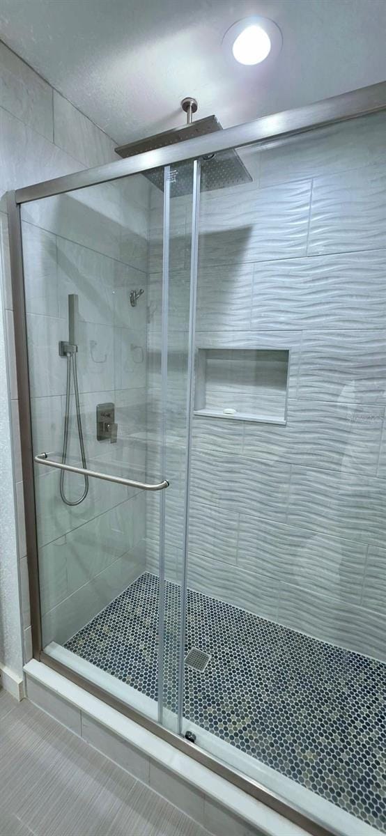 4730 Capital Blvd, Saint Cloud, FL 34769 - bathroom featuring a stall shower and tile patterned floors