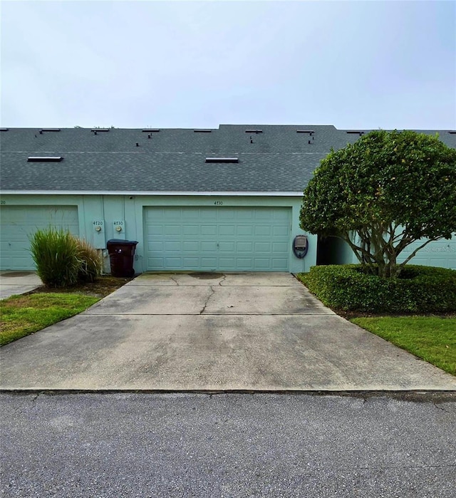 4730 Capital Blvd, Saint Cloud, FL 34769 - view of front of property with concrete driveway and a shingled roof