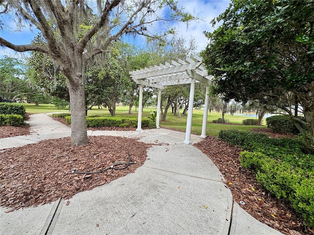 4730 Capital Blvd, Saint Cloud, FL 34769 - surrounding community featuring a lawn and a pergola