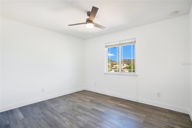 10124 Shadow Leaf Ct, Orlando, FL 32825 - empty room featuring dark wood-type flooring, ceiling fan, and baseboards