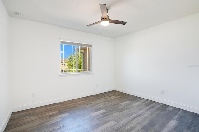 10124 Shadow Leaf Ct, Orlando, FL 32825 - unfurnished room featuring dark wood-type flooring, baseboards, and ceiling fan