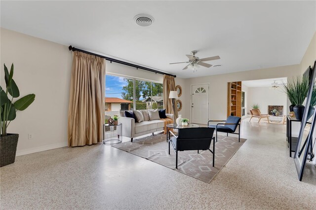 3107 Troy Dr, Orlando, FL 32806 - living room featuring visible vents, baseboards, a ceiling fan, and speckled floor