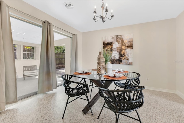 3107 Troy Dr, Orlando, FL 32806 - dining space featuring visible vents, baseboards, speckled floor, and a notable chandelier