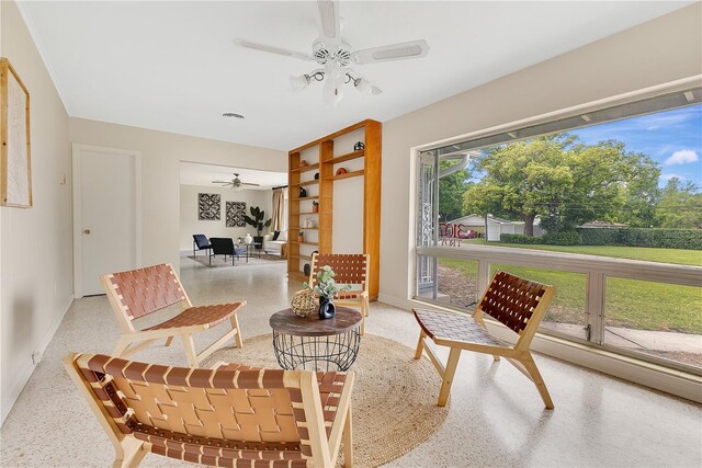 3107 Troy Dr, Orlando, FL 32806 - sitting room with baseboards, speckled floor, and ceiling fan